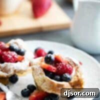 French Toast Cups filled with fresh berries on a plate