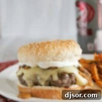 Signature Worcestershire Burgers with Gouda, Mushrooms, and Creamy Ranch 2 Worcestershire Burgers on a plate with sweet potato fries