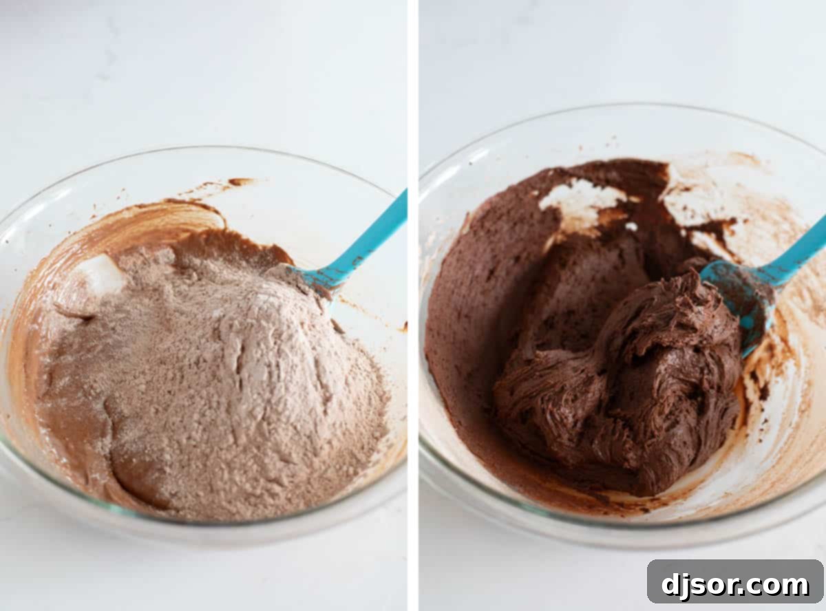 Close-up of dry ingredients being added to the chocolate cookie batter in a stand mixer, illustrating the final mixing stage for chocolate crinkle cookies.