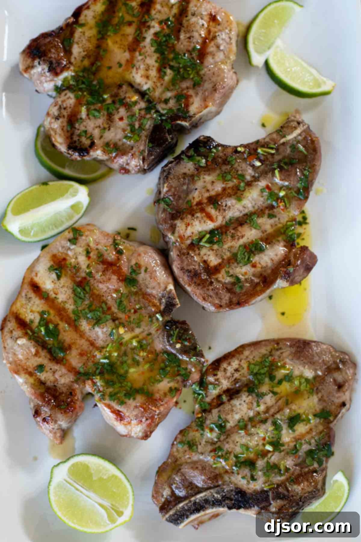 Zesty Cilantro-Lime Glazed Pork Chops 6 Grilled Pork Chops with Cilantro Lime Sauce on a serving platter.