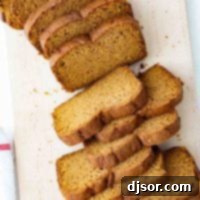 overhead view of sliced pumpkin bread on a cutting board