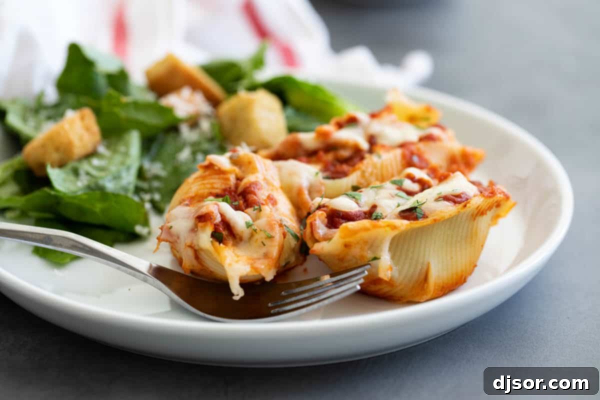 Plate of Chicken Stuffed Shells with Fresh Parsley Garnish