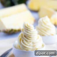 Homemade dole whip swirled in two bowls, ready to be served