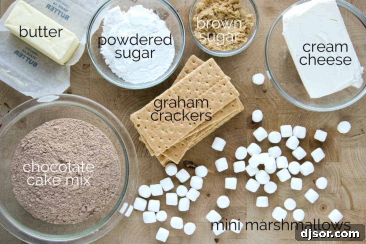 Various ingredients for making a S'mores Cheese Ball laid out on a counter.