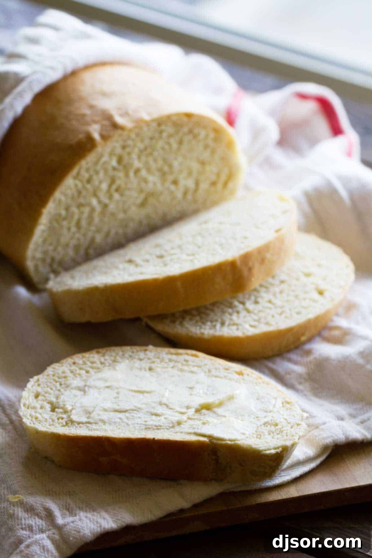 Golden Polenta Bread 5 A delectable slice of Polenta Bread generously spread with butter, ready to be enjoyed.