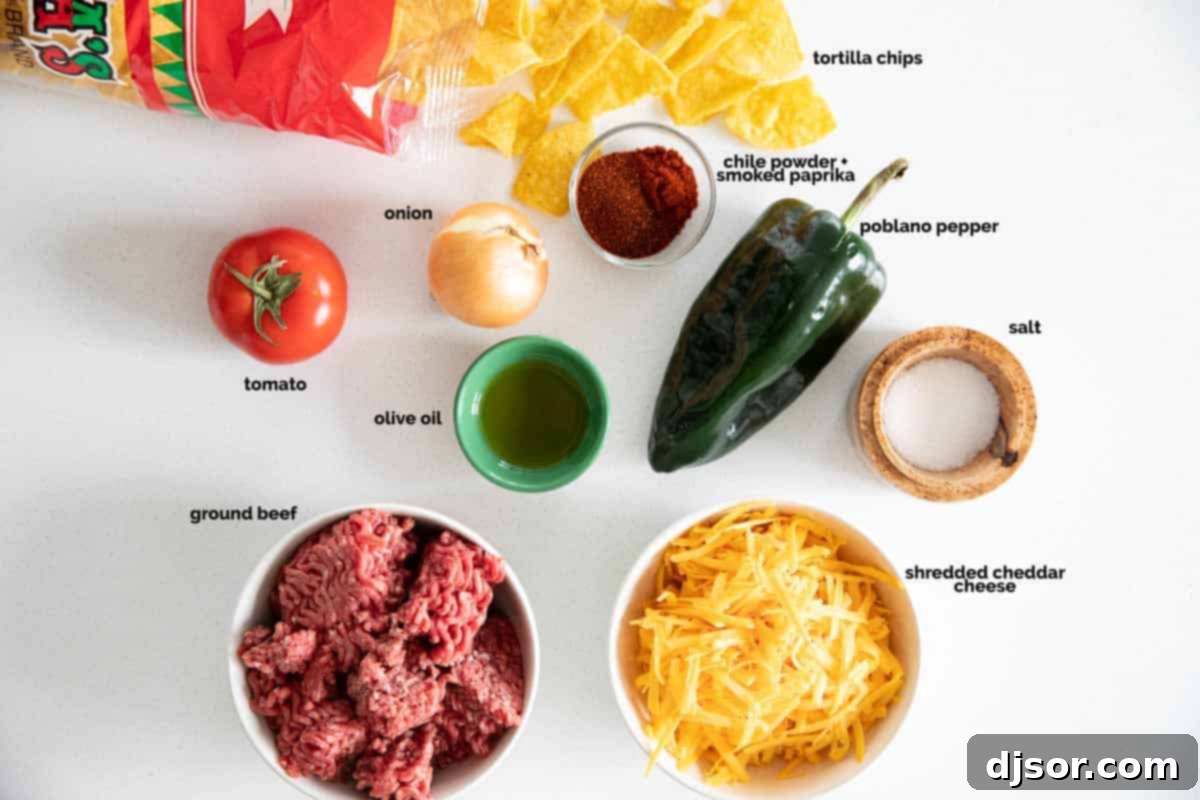 Fresh ingredients laid out for preparing the Taco Skillet, including onion, poblano, ground beef, tomatoes, and spices.