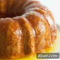 orange cake with orange glaze on a platter