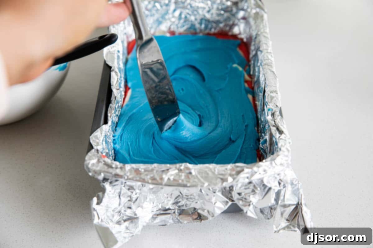 Achieve the perfect tie-dye look by gently swirling the patriotic layers of this delicious White Chocolate Fudge. Hand swirling layers of red, white, and blue fudge with a knife, creating a beautiful marbled effect for the 4th of July.