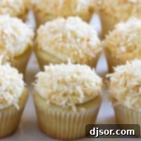 Coconut Cloud Cupcakes 6 True coconut lovers will appreciate these Coconut Snowball Cupcakes!