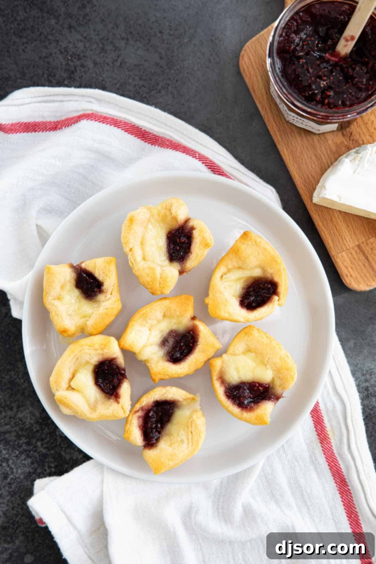 Irresistible Raspberry Brie Bites Brie Bites with Raspberry Jam and Crescent Rolls - closeup ready to serve.