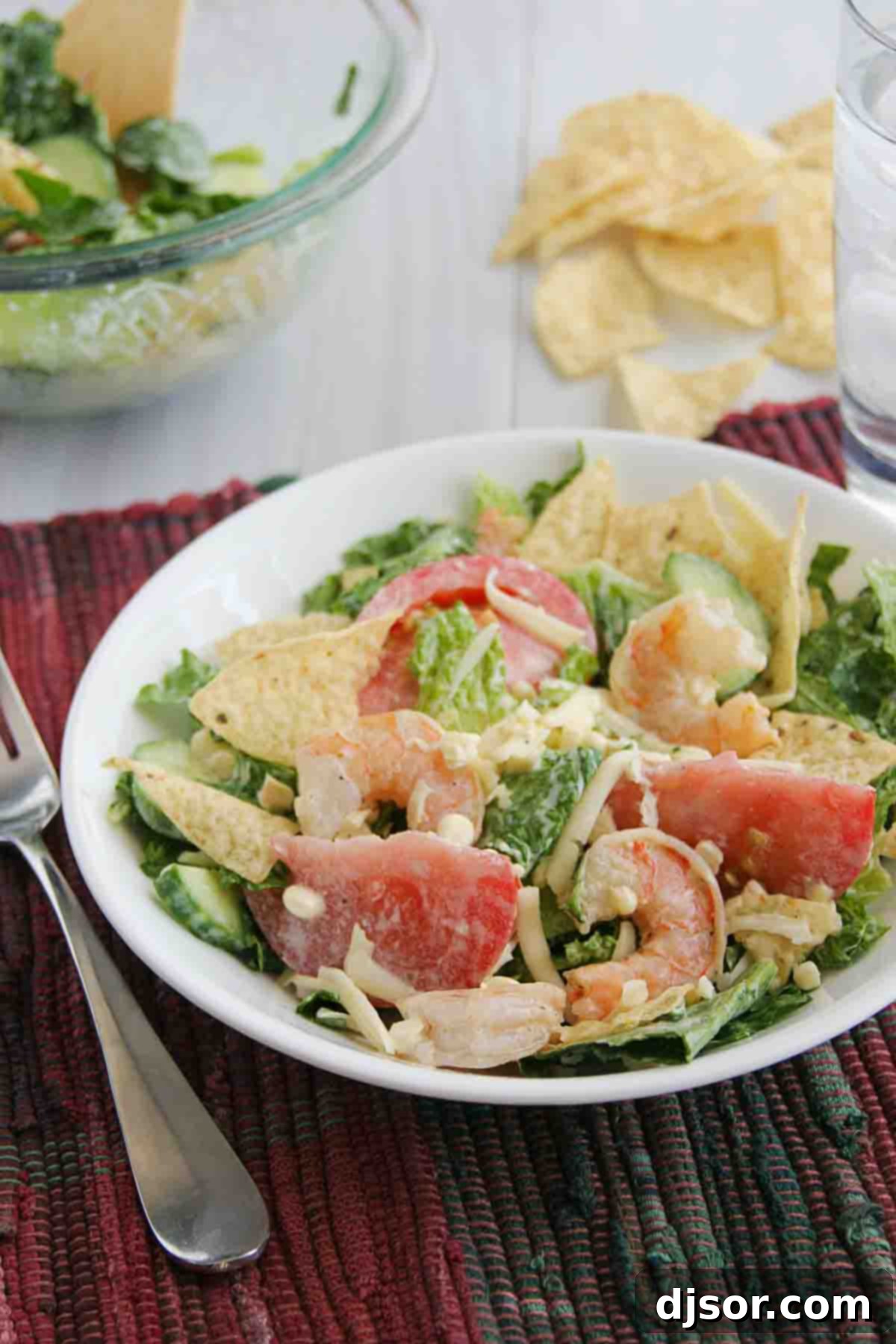 Vibrant Shrimp and Corn Salad topped with crispy tortilla chips, ready to be served
