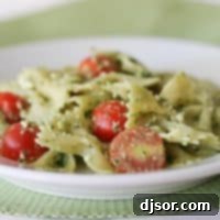 Mediterranean Pesto Feta Pasta 2 Pasta with Pesto, Feta and Cherry Tomatoes in a white bowl