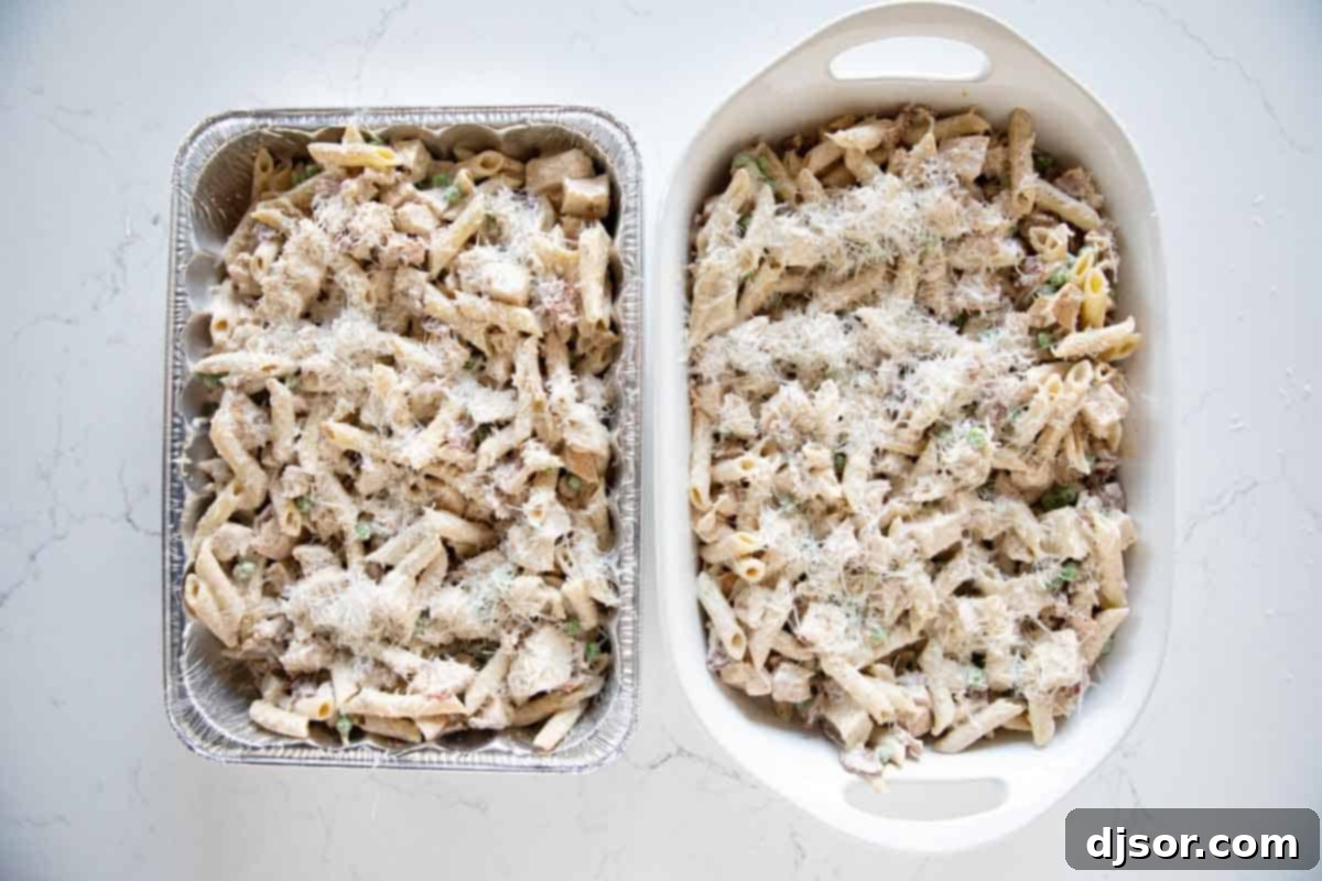 Two identical casserole dishes filled with golden-brown Chicken Bacon Pasta, perfectly baked and ready to be served or frozen. Two casserole dishes with Chicken Bacon Pasta.
