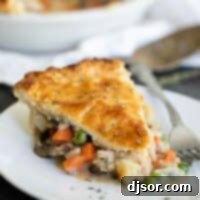Ultimate Comfort Chicken Bake 3 slice of chicken pot pie on a plate with the pan in the background