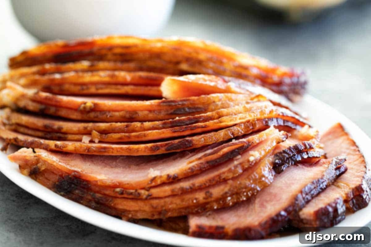 Deliciously Sliced Brown Sugar Glazed Ham Perfectly sliced Brown Sugar Glazed Ham ready for serving on a festive plate.