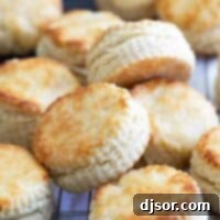 Homemade buttermilk biscuits cooling on a wire rack