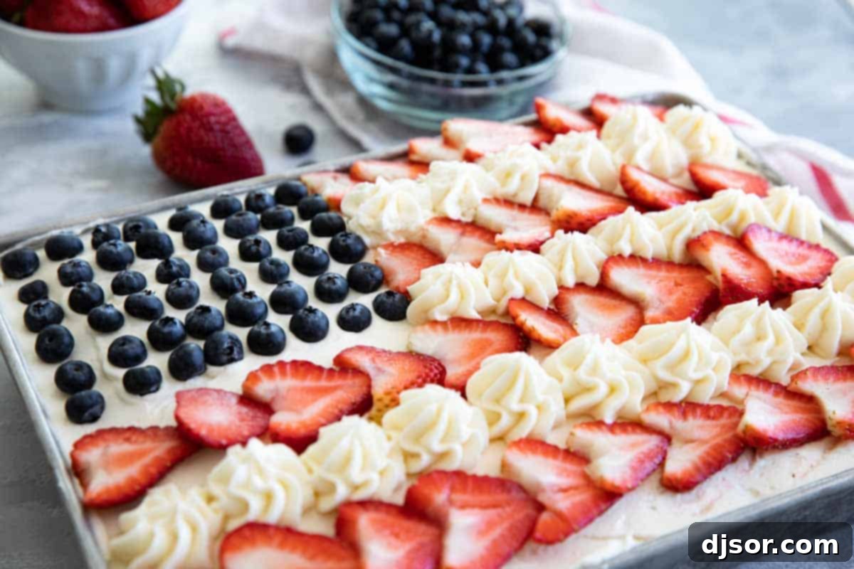 American Flag Cake with strawberries and blueberries, ready to be served at a celebration.