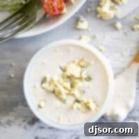 Artisan Blue Cheese Dressing 2 overhead view of creamy blue cheese dressing with crumbled blue cheese on top
