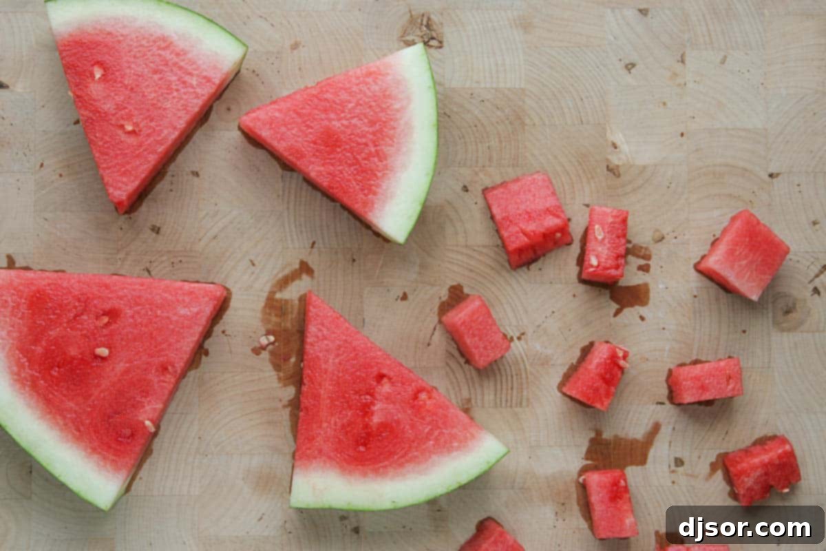Watermelon Chill 3 Fresh slices and perfectly cubed pieces of ripe watermelon, ready for preparation.