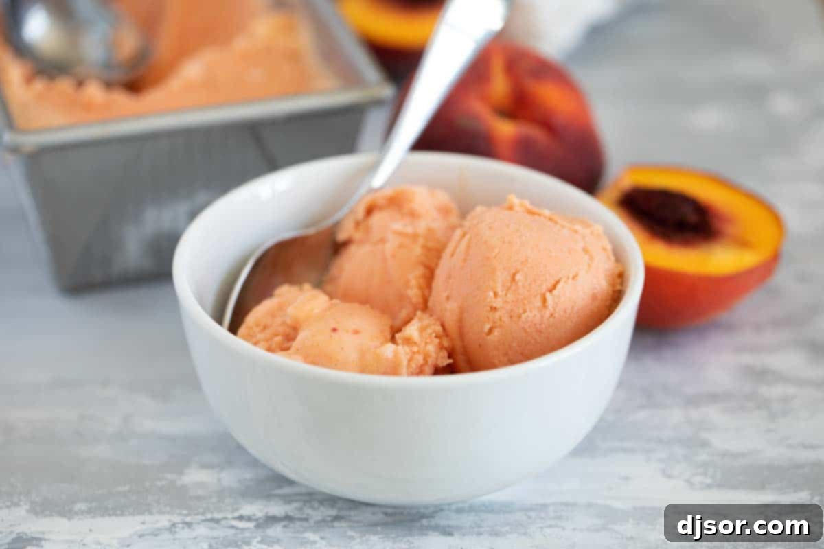 Sun-Kissed Peach Freeze 2 bowl of peach frozen yogurt with a spoon