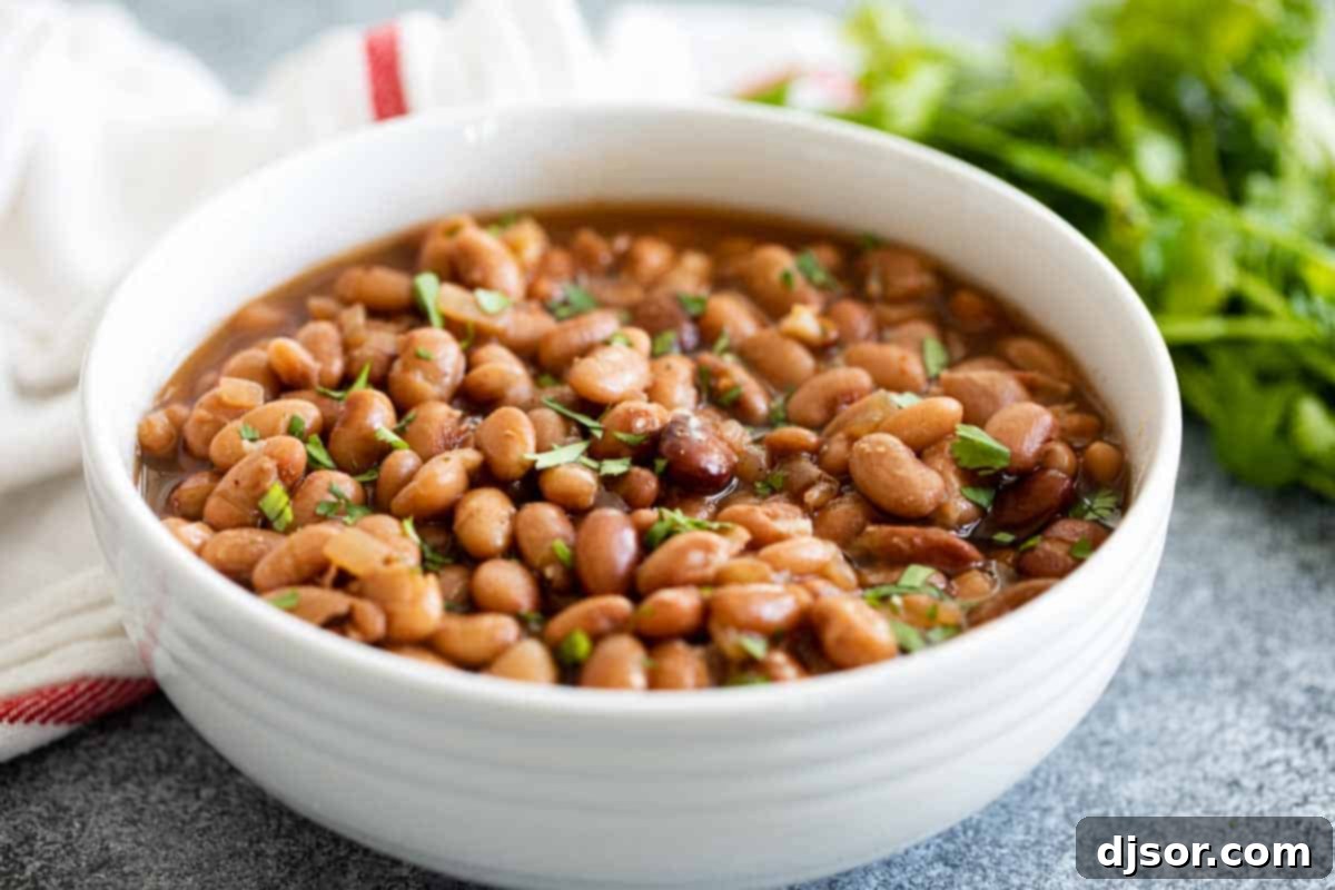 white bowl of instant pot pinto beans