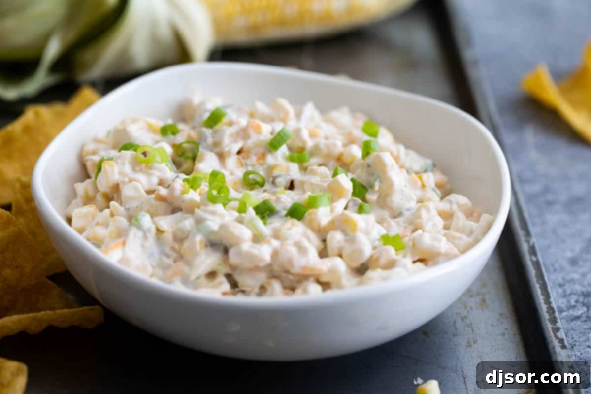 Creamy Corn Dip with Green Chiles in a serving bowl, ready for a party.
