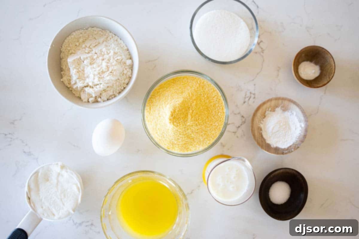 Essential Ingredients for Moist Corn Muffins A collection of fresh ingredients laid out on a kitchen counter, ready to be used for making a delicious corn muffin recipe.