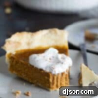 Autumn's Golden Slice 2 slice of pumpkin pie with forkfull taken from it