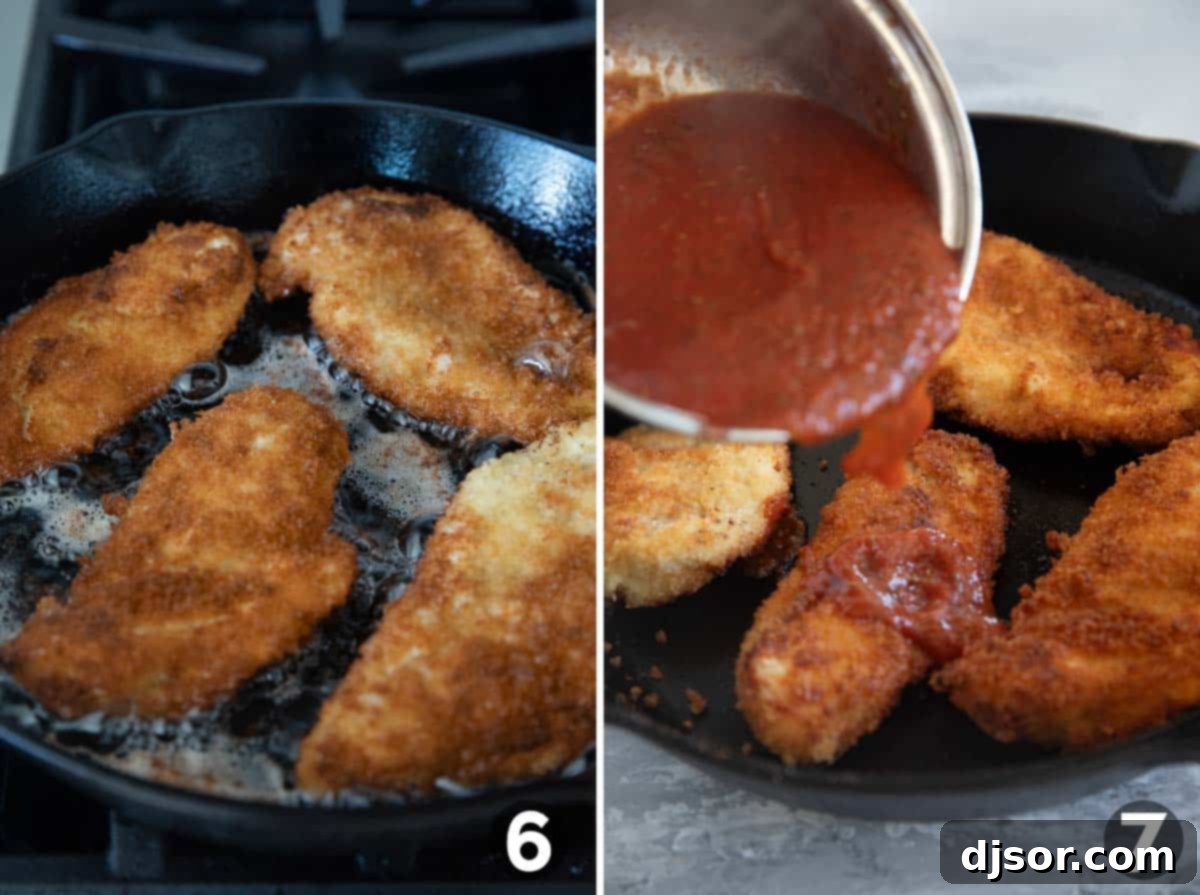 Crispy breaded chicken frying in hot oil in a cast iron skillet, with a side of prepared tomato sauce.