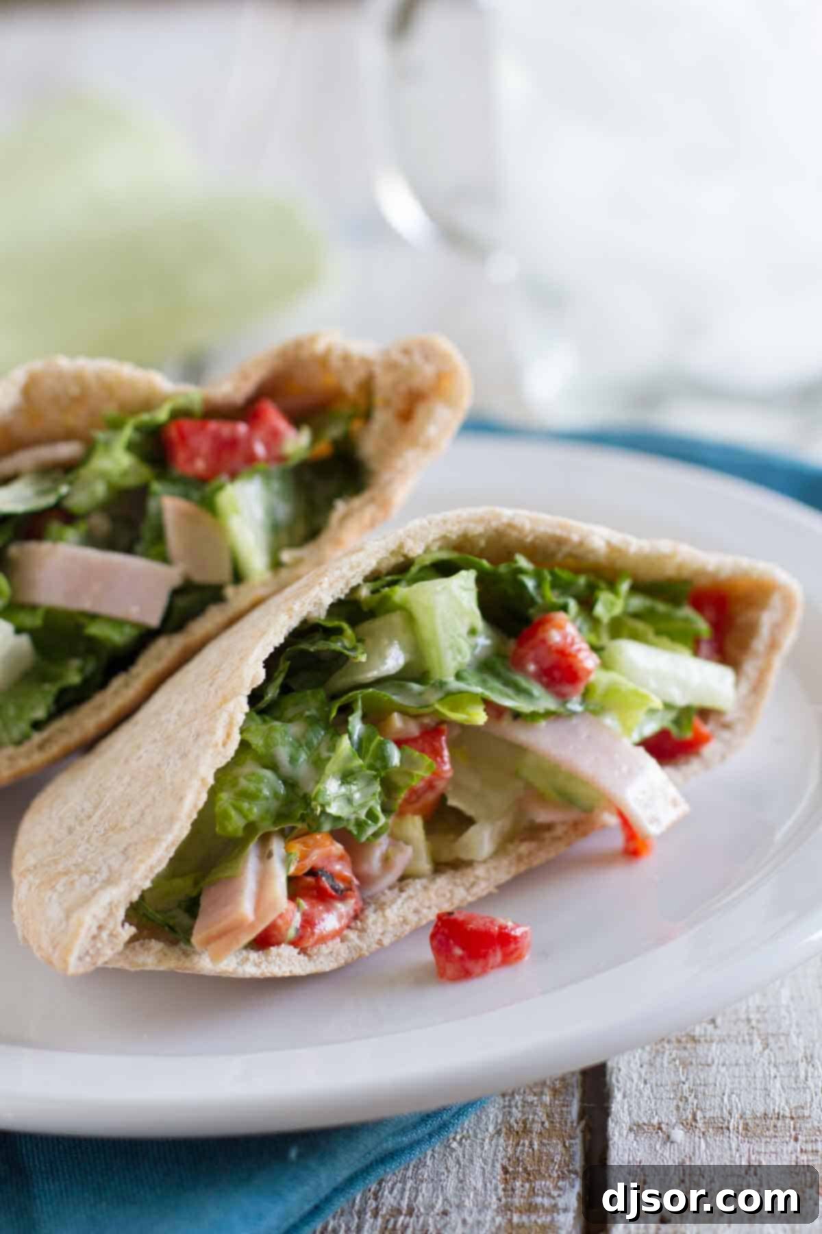 Delicious Caesar Pockets filled with turkey, fresh romaine lettuce, and vibrant roasted red peppers, ready for a quick meal.