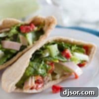 Close-up of a filled Caesar Pocket, showcasing the fresh ingredients and inviting texture.