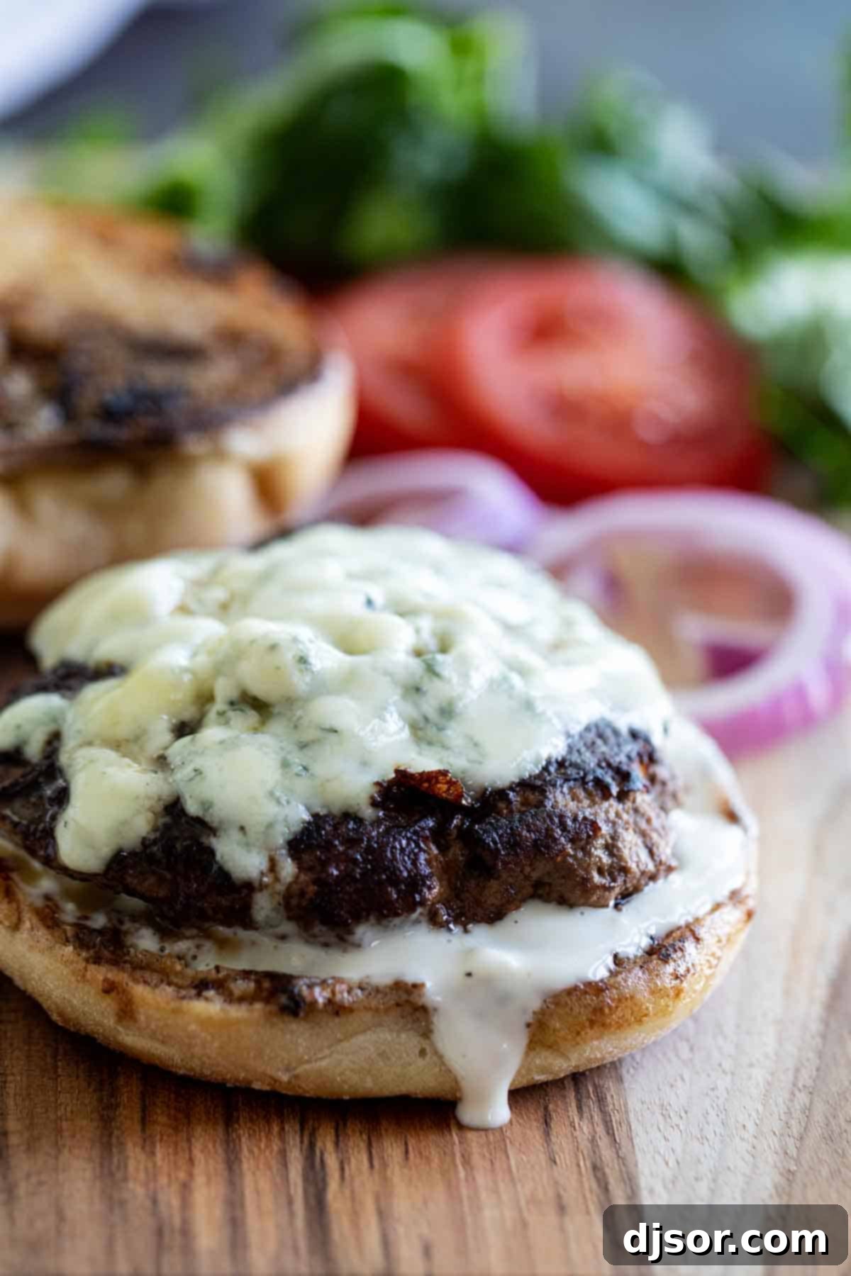 Nothing beats a juicy burger - especially when it’s topped with blue cheese! These Blue Cheese Burgers are simple yet filled with flavor. A gourmet Blue Cheese Burger topped with rich blue cheese and a creamy dressing, served on a toasted bun.