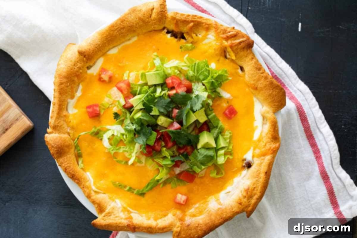 Baked Taco Pie Ready to Enjoy overhead view of a freshly baked taco pie, garnished with fresh toppings