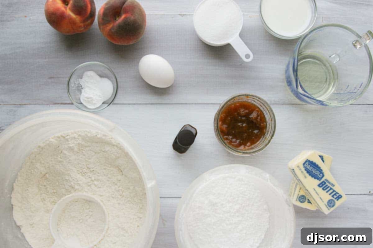 The best Peach Cupcakes - cupcakes are packed with peach flavor from peach jam and fresh peaches. Then they are topped with a delicious peach buttercream. ingredients to make peach cupcakes