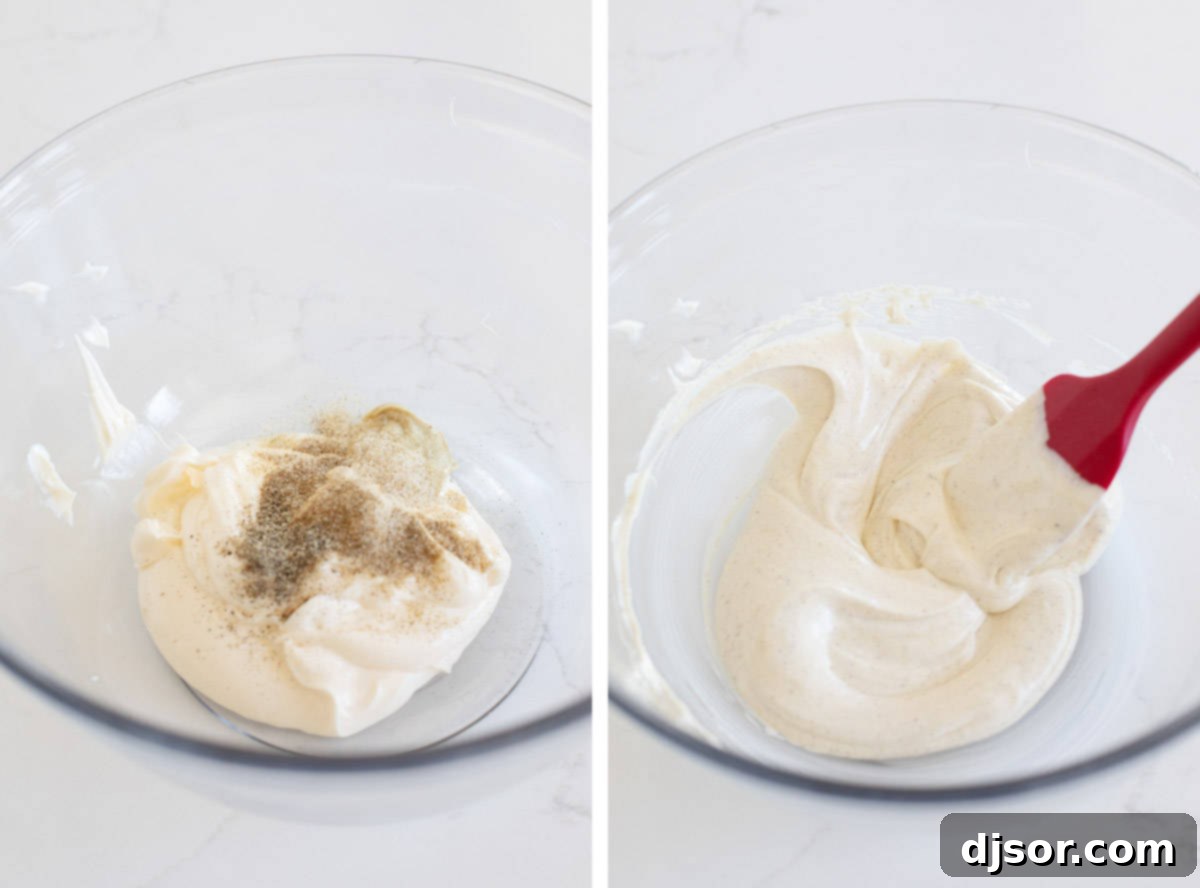 Mixing together mayonnaise, mustard, and seasonings to create the creamy dressing for chicken salad.