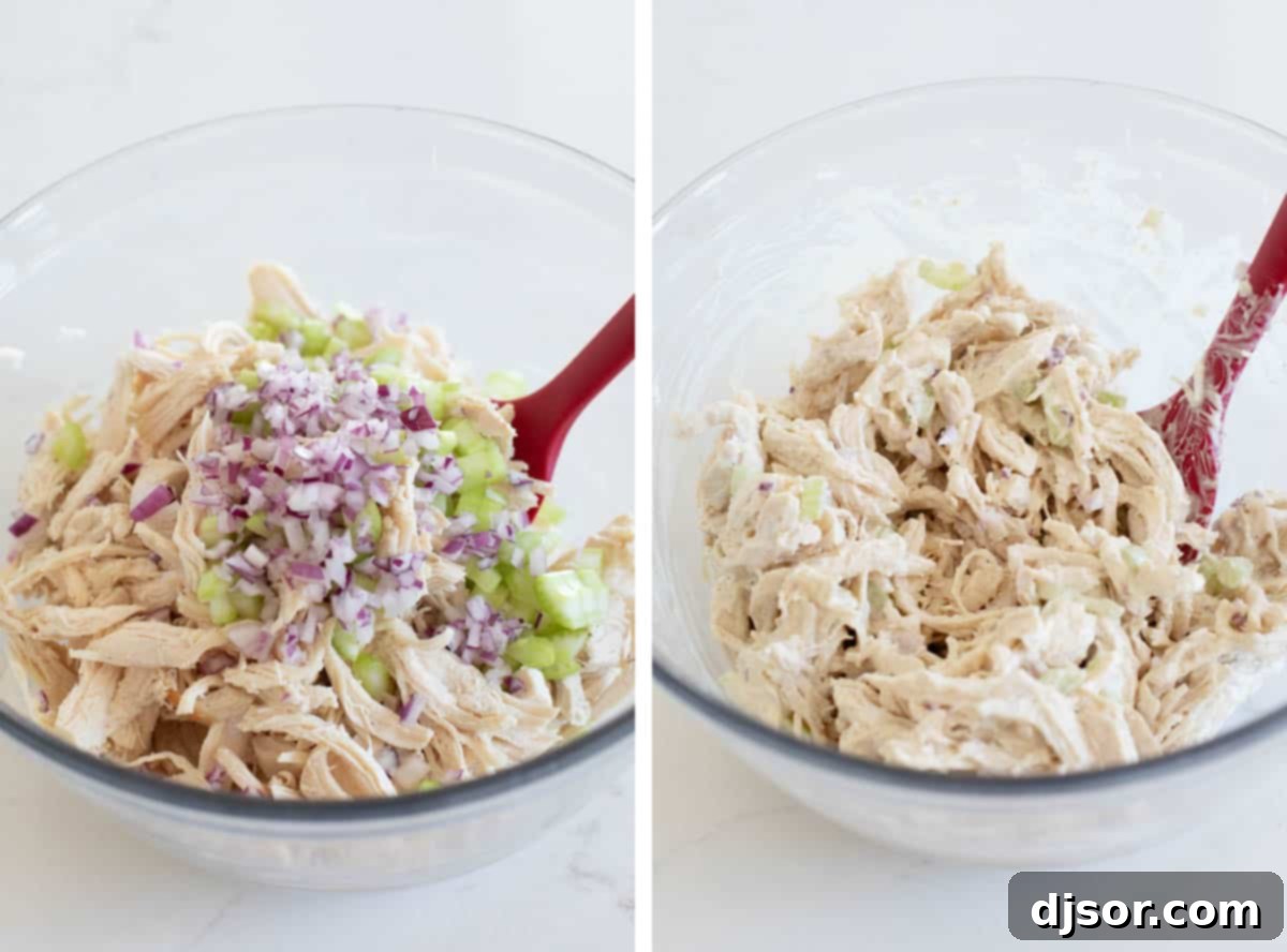 Mixing shredded chicken, crisp celery, and diced red onions into the creamy dressing for chicken salad.
