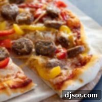 Hearty Sausage and Peppers Pizza 2 slice of pizza with sausage and peppers