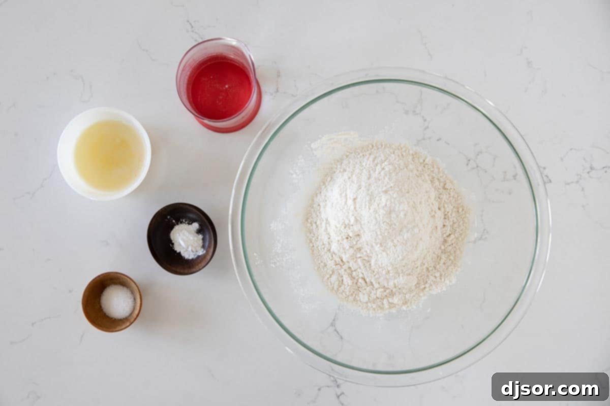 Ingredients needed to make flour tortillas, laid out on a clean surface.