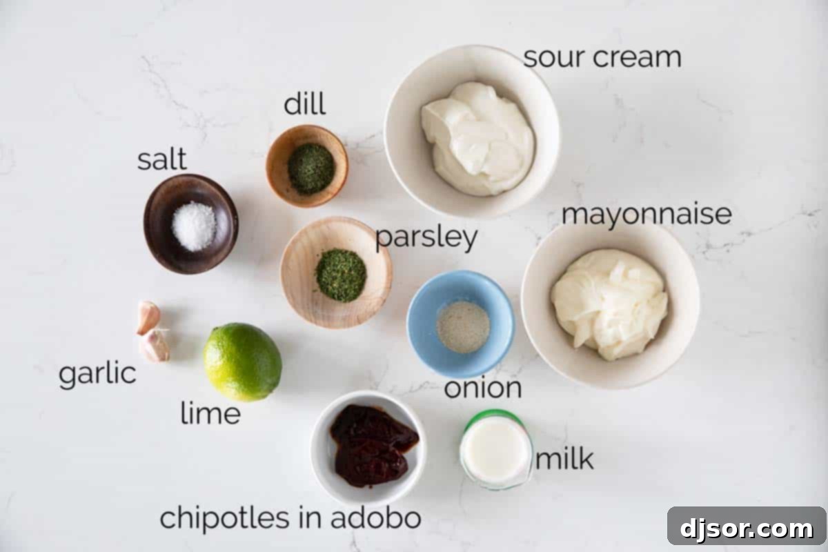 Key Ingredients for Chipotle Ranch Ingredients laid out on a table for making homemade Chipotle Ranch Dressing, including mayonnaise, sour cream, chipotle peppers, and herbs.