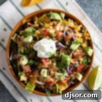 Fiesta Salad Bowl 5 Taco Salad topped with lots of toppings and tortilla chips