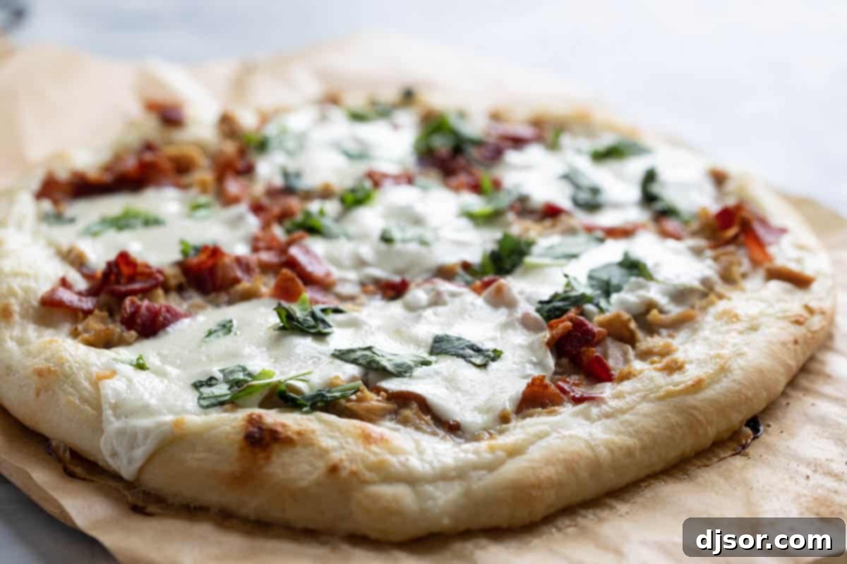 Savor the unique flavors of Clam Pizza with Bacon, featuring succulent clams, crispy bacon, and a rich alfredo sauce. Clam Pizza with Bacon topped with melted mozzarella and fresh basil leaves, ready to be served.