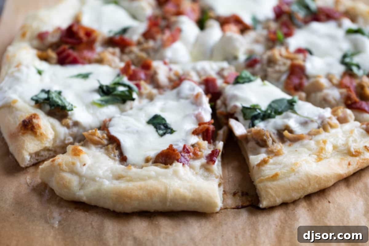 A perfect slice of clam and bacon pizza, showcasing its irresistible toppings. Close-up of a freshly baked pizza topped with clams and bacon, golden crust, and melted cheese.