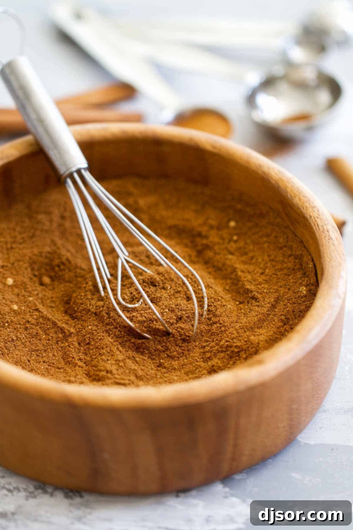 Freshly mixed homemade Pumpkin Pie Spice blend in a bowl, ready for use.