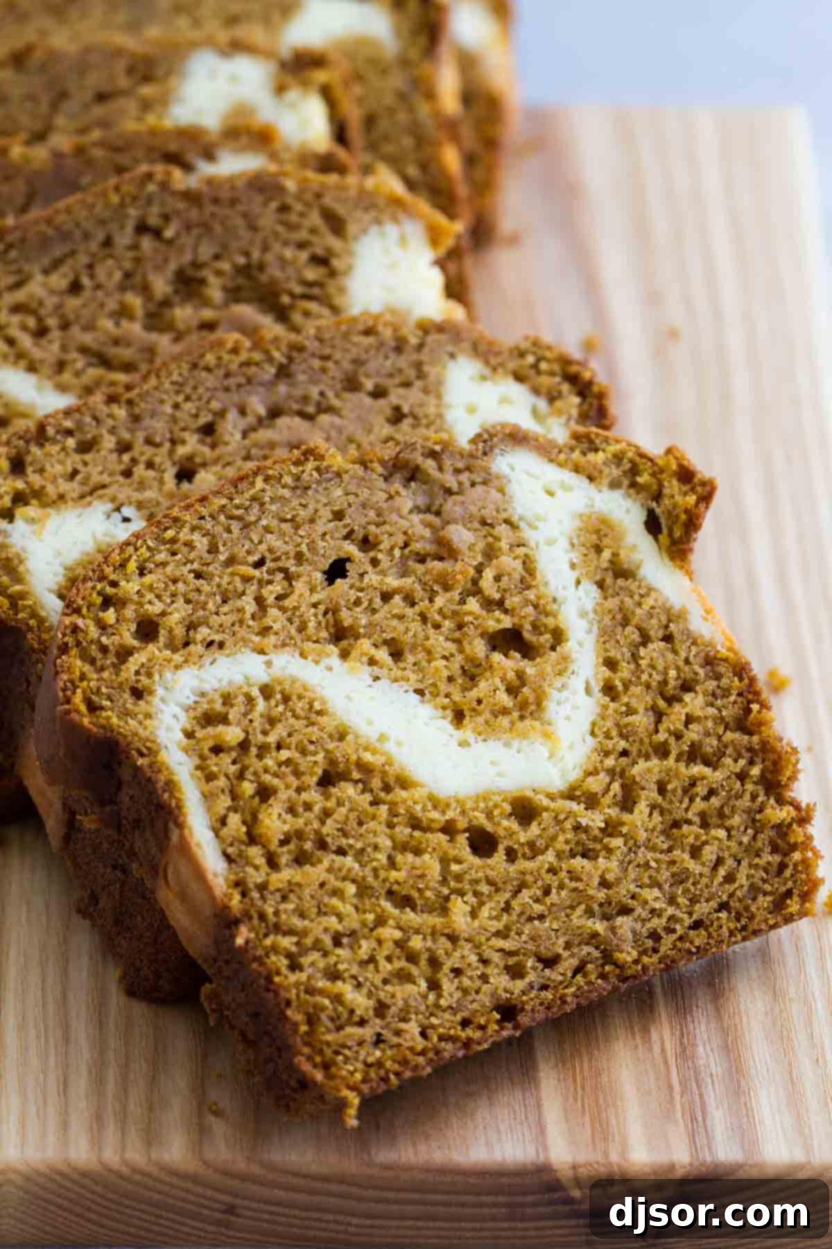 Slices of Cream Cheese Pumpkin Bread arranged on a platter.