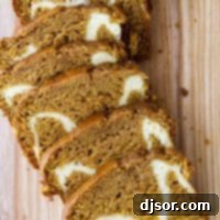 sliced cream cheese pumpkin bread, showcasing the filling.