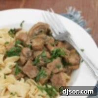Slow Cooker Beef Stroganoff with noodles and parsley