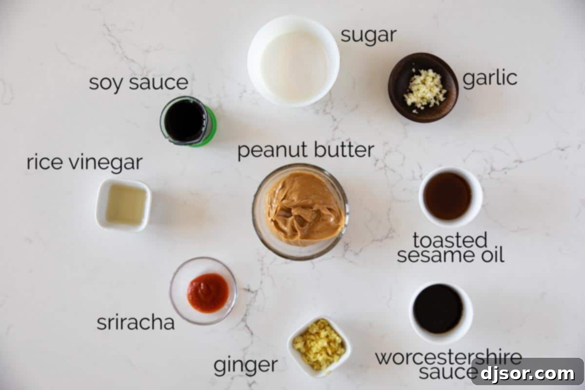 A vibrant selection of fresh ingredients laid out on a clean surface, ready to be combined for the perfect homemade peanut sauce.