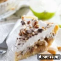 Taffy Apple Pie with a Cheesecake Twist 4 Slice of Taffy Apple Cheesecake Pie on a plate with pieces of caramel.