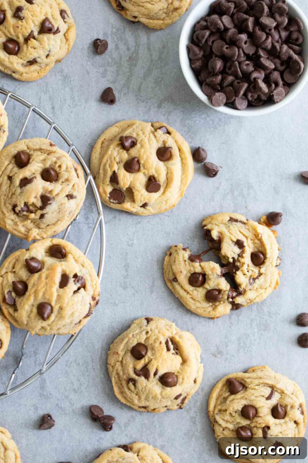 Chocolate chip pudding cookies with a bowl of chocolate chips.