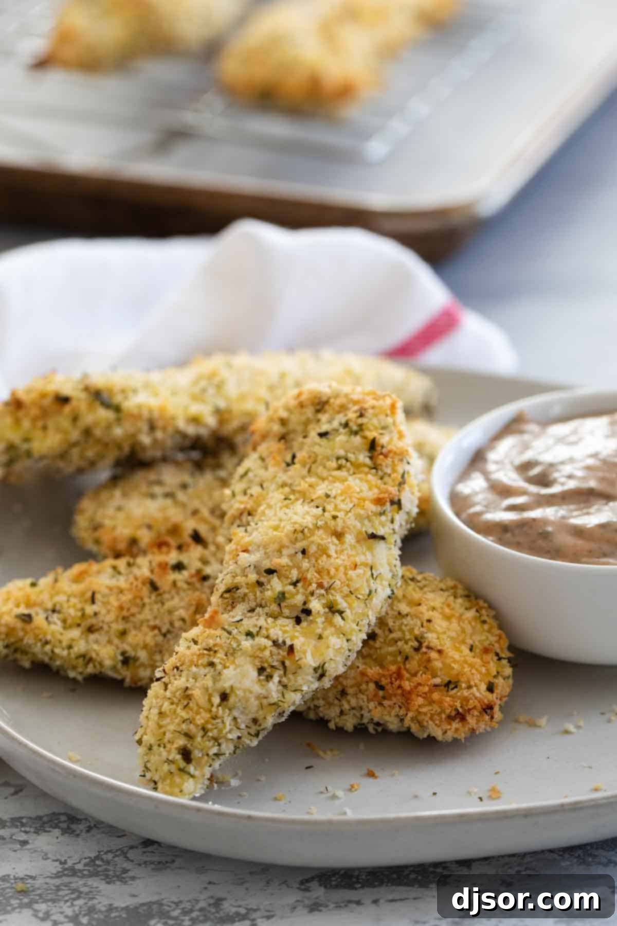 Simple & Satisfying Baked Chicken Strips: A Go-To Dinner Solution Easy and delicious baked chicken strips recipe for a quick family dinner.